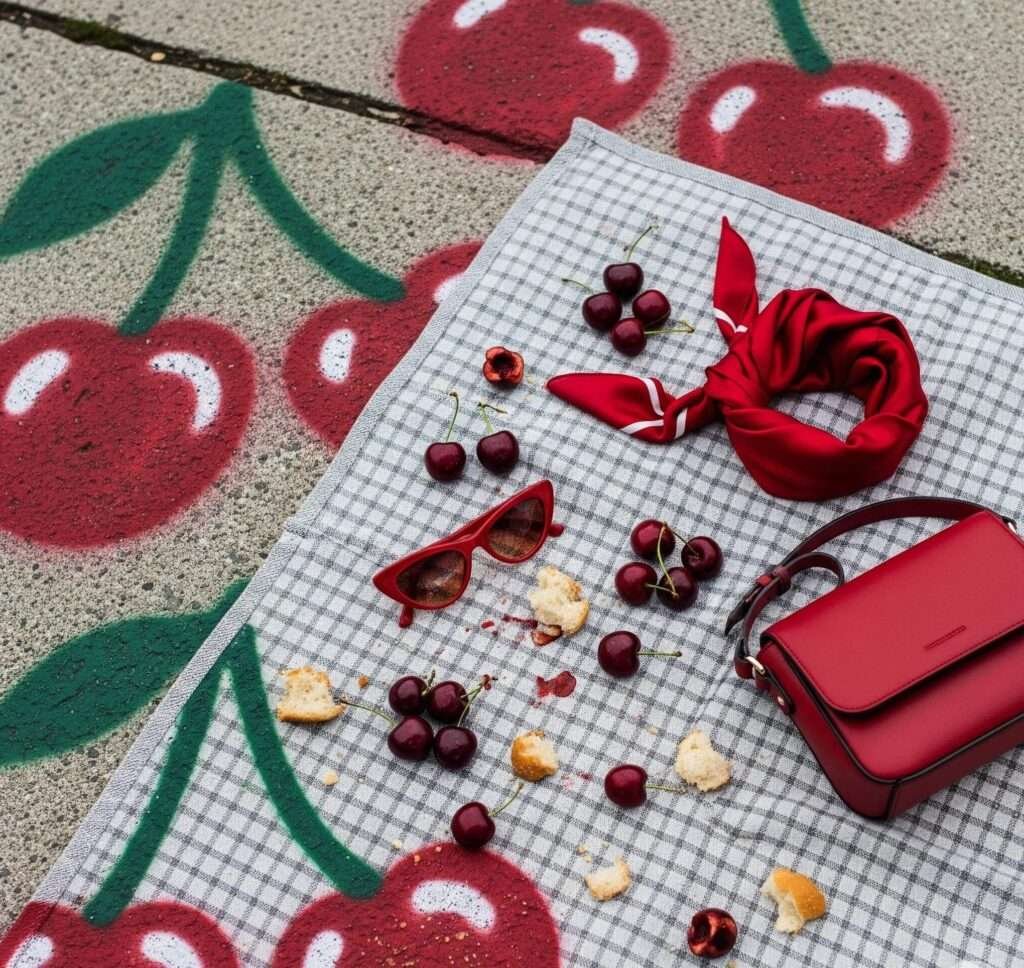 Hilarious Picnic Fail: A Red Accessory and Cherry Story