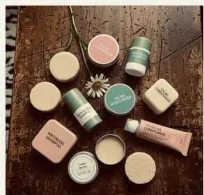 Chaotic flat-lay of waterless skincare products, vintage Polaroid style.