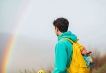 Can You Hike in a Matching Set? Asheville Trails That Work with Your Fit Check Hiker in neon teal on misty Asheville trail with smiley stick.