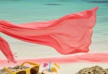 Turks & Caicos, But Make It Fashion: A Style Lover’s Guide to the Ultimate Island Escape Flapping sarong, sunglasses,